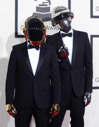 Daft Punk arrives at the 56th annual GRAMMY Awards at Staples Center on Sunday, Jan. 26, 2014, in Los Angeles. (Photo by Jordan Strauss/Invision/AP)
