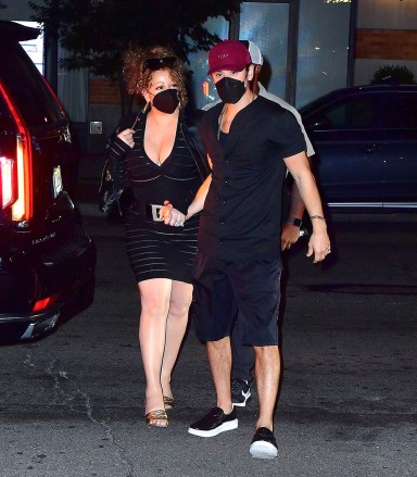 New York, NY - *EXCLUSIVE* - Still going strong!  Mariah Carey and Bryan Tanaka hold hands as they arrive for dinner at fancy Mr.  Chow New York.  Pictured: Mariah Carey, Bryan Tanaka BACKGRID USA 3 AUGUST 2022 USA: +1 310 798 9111 / usasales@backgrid.com UK: +44 208 344 2007 / uksales@backgrid.com *UK Clients - Pictures Containing Children Please Pixelate Face Prior To Publication*