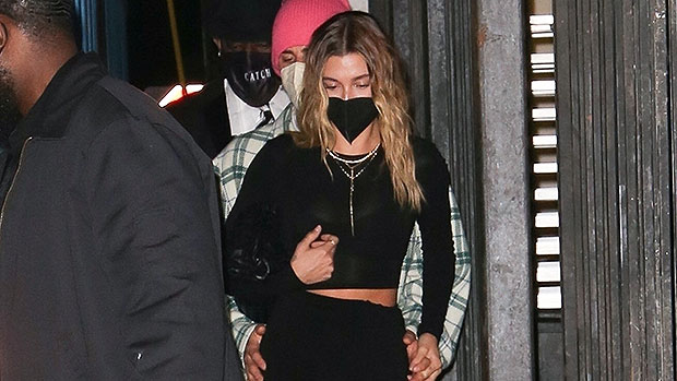 Hailey Bieber in black dress with black gold chain bag on February 26 2021