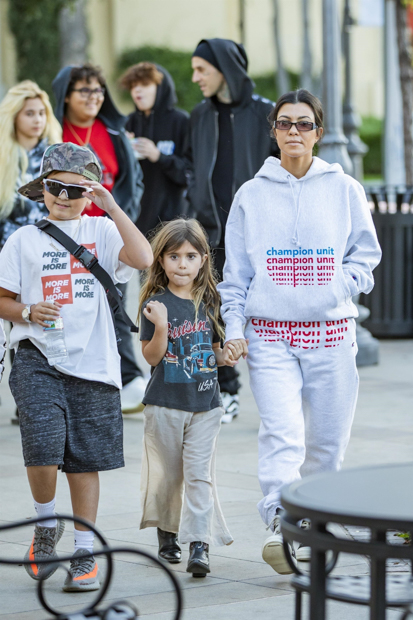 Calabasas, CA - *EXCLUSIVE* - Kourtney Kardashian takes the kids on a sweet treat with Travis Barker.  The duo look casual as the two families leave the ice cream parlor together.  Pictured: Kourtney Kardashian, Travis Barker BACKGRID USA DECEMBER 2, 2018 BYLINE MUST READ: IXOLA / BACKGRIDUSA: +1 310 798 9111 / usasales@backgrid.comUK: +44 208 344 2007 / uksales@backgrid.com*UK Customers - Photos with children Pixel face before publishing*