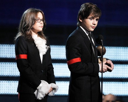 Michael Jackson's children Paris, left, and Prince Michael Jackson II accept the Lifetime Achievement award on behalf of their father at the Grammy Awards on Sunday, Jan. 31, 2010, in Los Angeles.  (AP Photo/Matt Sayles)