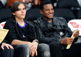 Prince Jackson, son of the late pop star Michael Jackson sits with uncle Jackie Jackson during an NBA basketball game between the Los Angeles Lakers and the Utah Jazz, Tuesday, Jan. 25, 2011, in Los Angeles.(AP Photo/Gus Ruelas)
