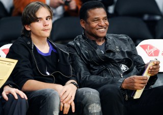 Prince Jackson, son of the late pop star Michael Jackson sits with uncle Jackie Jackson during an NBA basketball game between the Los Angeles Lakers and the Utah Jazz, Tuesday, Jan. 25, 2011, in Los Angeles.(AP Photo/Gus Ruelas)