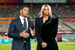 Seattle Seahawks quarterback Russell Wilson and his wife Ciara talk make a statement after Wilson won the Walter Payton NFL Man of the Year awards at the NFL Honors ceremony as part of Super Bowl 55 Friday, Feb. 5, 2021, in Tampa, Fla. (AP Photo/Charlie Riedel)