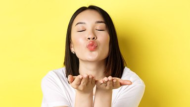 woman blowing a kiss