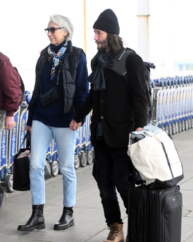 Keanu Reeves and his girlfriend Alexandra Grant holding hands while arriving at JFK International Airport in New York CityPictured: Keanu Reeves,Alexandra GrantRef: SPL5596698 280423 NON-EXCLUSIVEPicture by: Elder Ordonez / SplashNews.comSplash News and PicturesUSA: +1 310-525-5808London: +44 (0)20 8126 1009Berlin: +49 175 3764 166photodesk@splashnews.comWorld Rights, No Poland Rights, No Portugal Rights, No Russia Rights
