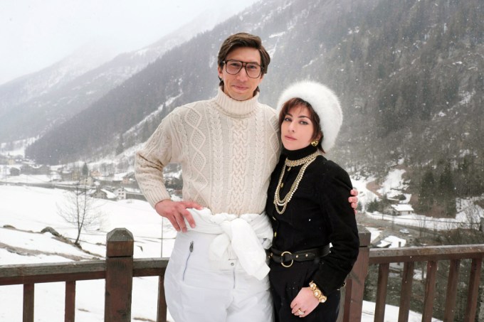 Lady Gaga and Adam Driver pose in a snowy setting