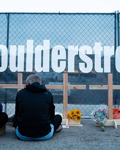 People lay flowers at a growing memorial at the scene a day after Ahmad Al Aliwi Alissa allegedly to have killed ten people including a police officer, at the King Soopers supermarket in Boulder, Colorado, USA, 23 March 2021. Boulder Police released the names of all ten victims as Denny Strong, 20, Neven Stanisic, 23, Rikki Olds, 25, Tralona Bartkowiak, 49, Suzanne Fountain, 59, Teri Leiker, 51, Eric Talley, 51, Kevin Mahoney, 61, Lynn Murray, 62 and Jody Waters, 65.Aftermath of mass shooting in Colorado, Boulder, USA - 23 Mar 2021