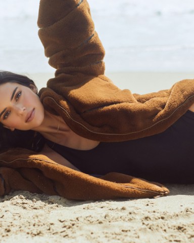 Kendall Jenner poses by the ocean as she stars in Alo’s first ever Holiday Jackets and Coats campaign for Fall 2021. Alo - which stands for Air, Land and Ocean - says the collection is meant to be worn from coast to coast, with jackets and coats for every climate. The collection will drop throughout the holiday season, launching with the Stunner Puffer. Kendall has been a longstanding ambassador for the celebrity-favourite athletic brand, which also includes menswear, yoga gear and a beauty line focused on getting the ultimate glow. She says in a video for the campaign: “I actually remember the first time I went to Alo, must have been six or seven years ago. I feel like it was right when they popped up. “And I just loved it. I think there stuff is amazing, and so I’ve been on to Alo for a minute now.” *BYLINE: Alo/Mega. 05 Oct 2021 Pictured: Kendall Jenner stars in Alo’s Holiday Jackets and Coats campaign for Fall 2021. *BYLINE: Alo/Mega. Photo credit: Alo/MEGA TheMegaAgency.com +1 888 505 6342 (Mega Agency TagID: MEGA793828_001.jpg) [Photo via Mega Agency]