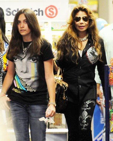 La Toya Jackson, Paris Jackson
La Toya Jackson, Paris Jackson and Blanket Jackson go shopping for toys in Beverly Hills, Los Angeles, America - 31 Mar 2011
Just days after tearfully speaking about his death La Toya Jackson was spotted out and about in Los Angeles today with two her late brother Michael's Jackson's children. Like any dutiful auntie, La Toya took Paris and 'Blanket' Jackson out shopping for toys. The outing came just days after La Toya's tearful appearance on The Ellen Degeneres Show where she spoke about Michael's death. "It's been a rough time," she said. "Michael was one of the most loved people in the world." She also revealed that she learned of her brother's death while driving to the UCLA Medical Centre.: "[My mother Katherine] grabbed the phone and she screamed as loud as she could, [saying] 'He's dead!' When she did that, I almost crashed the car. I started crying and my head went to the steering wheel". Last month La Toya insisted that Michael's three children are adjusting well to life without their father and that she has formed a very close bond with Prince Michael, Paris, and Prince Michael II.