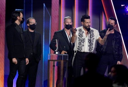 Matthew Ramsey, second from right, and members of Old Dominion, accept the award for group of the year at the 56th annual Academy of Country Music Awards, at the Grand Ole Opry in Nashville, Tenn
2021 Academy of Country Music Awards, Nashville, United States - 18 Apr 2021