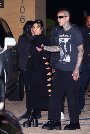 MALIBU, Calif. - *EXCLUSIVE* - The Barkers are celebrating their recent wedding with a date night in Nobu, and we see Kourtney Kardashian Barker in a killer black dress while Travis in his signature dark style. Travis Buck's stepdaughter Atiana de la Hoya was seen leaving the restaurant with the couple. Pictured: Kourtney Kardashian, Travis Barker BACKGRID USA 2 June 2022 USA: +1 310 798 9111 / usasales@backgrid.com UK: +44 208 344 2007 / uksales@backgrid.com *UK customers - includes images of children , please pixelate face publications first*