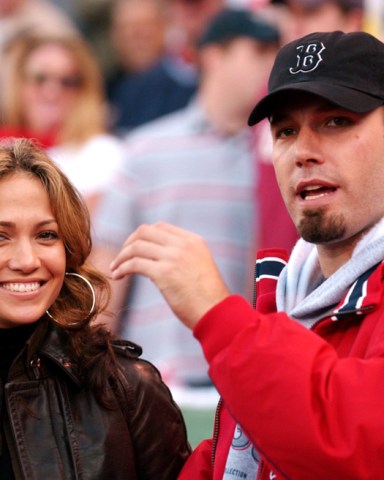 Us Actors Jennifer Lopez (l) and Ben Affleck (r) Watch the Pre-game Ceremony Before the Start of Game 3 of the American League Championship Series Between the Boston Red Sox and New York Yankees 11 October 2003 at Fenway Park in Boston Ma the Best-of-seven Series is Tied 1-1 Usa Baseball Alcs - Oct 2003