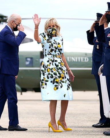 President Joe Biden salutes as he and first lady Jill Biden board Air Force One for a trip to Georgia to mark his 100th day in office, in Andrews Air Force Base, Md
Biden, Andrews Air Force Base, United States - 29 Apr 2021