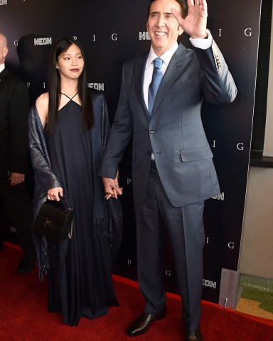 Riko Shibata, left, and Nicolas Cage arrive at the Los Angeles premiere of "Pig", at the Nuart Theatre Premiere of "Pig", Los Angeles, United States - 13 Jul 2021