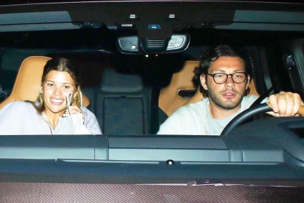 Los Angeles, California - * EXCLUSIVE * - Influencer Sofia Richie behaves shyly while being discovered by a new mysterious man!  The two were caught by paparazzi picking up food at Matsuhisa, and when they tried to leave, they ended up getting caught in the flash madness.  Pictured: Sofia Richie BACKGRID USA APRIL 6, 2021 BYLINE MUST READ: BACKGRID USA: +1 310 798 9111 / usasales@backgrid.com UK: +44 208 344 2007 / uksales@backgrid.com * UK customers with children - Pixelate please Before release *