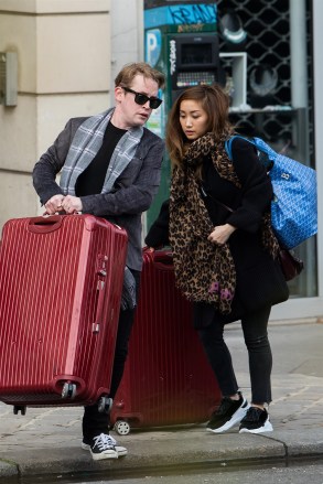 ** RIGHTS: ONLY UNITED STATES, AUSTRALIA, CANADA, NEW ZEALAND ** Paris, FRANCE  - *EXCLUSIVE*  - 'Home Alone' star Macaulay Culkin and his girlfriend Brenda Song have their hands full with luggage while leaving their apartment in Paris to go to the Roissy CDG airport. The former child star recently made headlines after changing his middle name to 'Macaulay Culkin.'Pictured: Macaulay Culkin, Brenda SongBACKGRID USA 2 JANUARY 2019 BYLINE MUST READ: Best Image / BACKGRIDUSA: +1 310 798 9111 / usasales@backgrid.comUK: +44 208 344 2007 / uksales@backgrid.com*UK Clients - Pictures Containing ChildrenPlease Pixelate Face Prior To Publication*