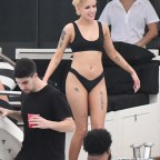 EXCLUSIVE: Singer Halsey wears a black bikini and shows some PDA with boyfriend G-Easy on a yacht in Miami