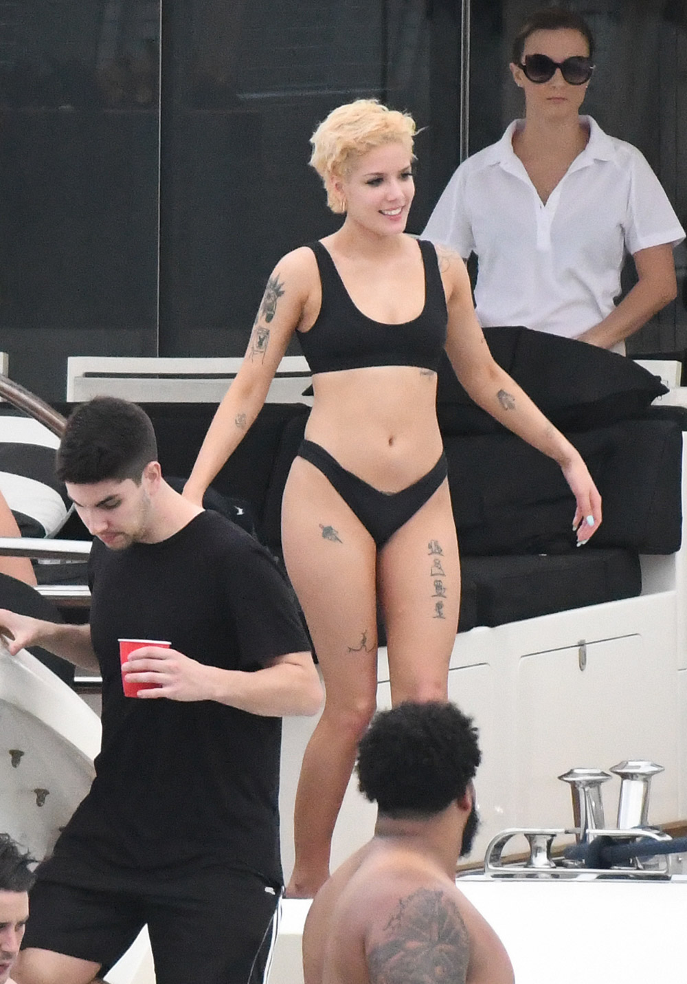 EXCLUSIVE: Singer Halsey wears a black bikini and shows some PDA with boyfriend G-Easy on a yacht in Miami