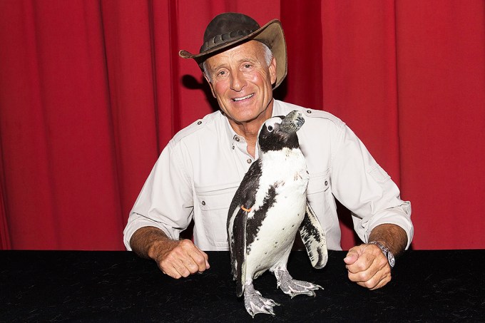 Jack Hanna poses with a penguin in Austin, Texas