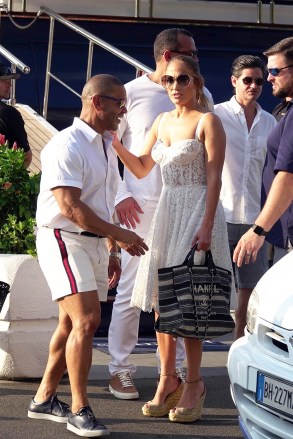 ** RIGHTS: ONLY UNITED STATES, BRAZIL, CANADA ** Capri, ITALY  - *EXCLUSIVE* Jennifer Lopez is spotted heading out for a day of shopping in a stunning white laced dress holding her designer Chanel bag with an equally stylish Alex Rodriguez by her side. J-Lo and A-Rod were joined by Jennifer's manager and music producer Benny Medina and all looked relaxed as they mingled with Miami Heat owner Micky Arison aboard his 185 foot mega yacht, Sirona III. **SHOT ON 8/7/18**

Pictured: Jennifer Lopez, Alex Rodriguez

BACKGRID USA 8 AUGUST 2018 

USA: +1 310 798 9111 / usasales@backgrid.com

UK: +44 208 344 2007 / uksales@backgrid.com

*UK Clients - Pictures Containing Children
Please Pixelate Face Prior To Publication*