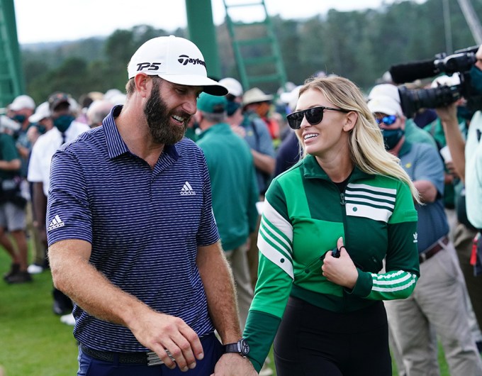 Dustin Johnson and Paulina Gretzky as he walks to the 18th green at the 2020 Masters