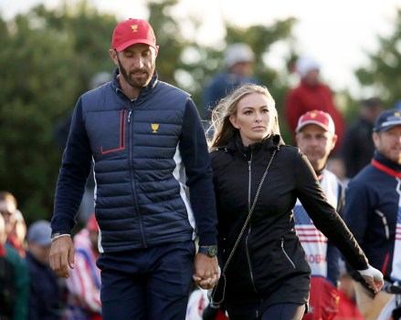 Dustin Johnson, Paulina Gretzky. United States team member Dustin Johnson and his wife Paulina Gretzky walk toward the 18th hole to watch play during the four-ball golf matches on the third day of the Presidents Cup at Liberty National Golf Club in Jersey City, N.J
Presidents Cup Golf - 30 Sep 2017