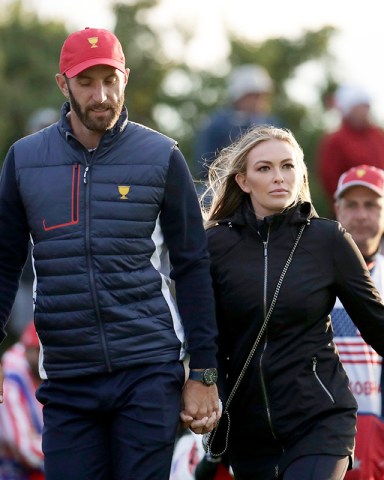 Dustin Johnson, Paulina Gretzky. United States team member Dustin Johnson and his wife Paulina Gretzky walk toward the 18th hole to watch play during the four-ball golf matches on the third day of the Presidents Cup at Liberty National Golf Club in Jersey City, N.J
Presidents Cup Golf - 30 Sep 2017