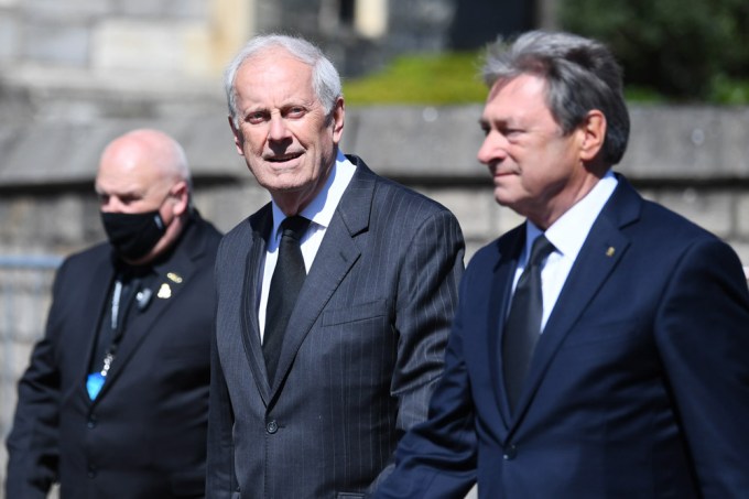 Gyles Brandreth and Alan Titchmarsh walking outside the chapel
