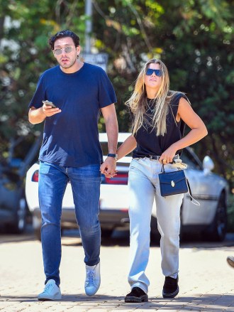 EXCLUSIVE: Sofia Richie and her new boyfriend Elliot Grainge step out for a romantic lunch date in Malibu. The pair held hands as they made their way home after having lunch at Taverna Tony's in Malibu. 05 Jun 2021 Pictured: Sofia Richie and Elliot Grainge. Photo credit: @CelebCadidly / MEGA TheMegaAgency.com +1 888 505 6342 (Mega Agency TagID: MEGA760347_005.jpg) [Photo via Mega Agency]
