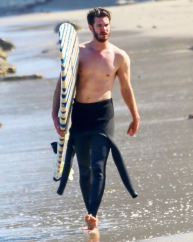 Malibu, CA  - *EXCLUSIVE*  - Andrew Garfield peels off his wetsuit midway revealing his fit form as he is spotted surfing in LA amid reports actor has inked Multi-Movie MCU Deal. The actor joked about retiring back in April to later clarify "'I've been working hard and I've been loving the work that I'm doing, but also, I need to take a month or so. A month of a break, maybe two'' he told Joy Behar on the View.

Pictured: Andrew Garfield

BACKGRID USA 30 JUNE 2022 

BYLINE MUST READ: apples / BACKGRID

USA: +1 310 798 9111 / usasales@backgrid.com

UK: +44 208 344 2007 / uksales@backgrid.com

*UK Clients - Pictures Containing Children
Please Pixelate Face Prior To Publication*