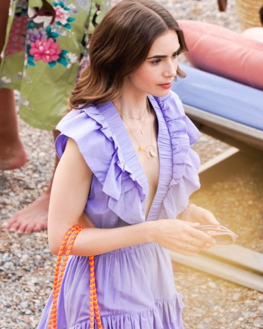 Saint-Jean-Cap-Ferrat, FRANCE  - British-American actress Lily Collins pictured in character while on set filming scenes for season 2 of Netflix series 'Emily In Paris' in Saint-Jean-Cap-Ferrat, France.Pictured: Lily CollinsBACKGRID USA 4 MAY 2021 USA: +1 310 798 9111 / usasales@backgrid.comUK: +44 208 344 2007 / uksales@backgrid.com*UK Clients - Pictures Containing ChildrenPlease Pixelate Face Prior To Publication*