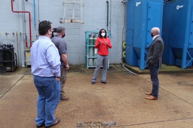 Jennifer Conversing With Civilians At A Local Job Site