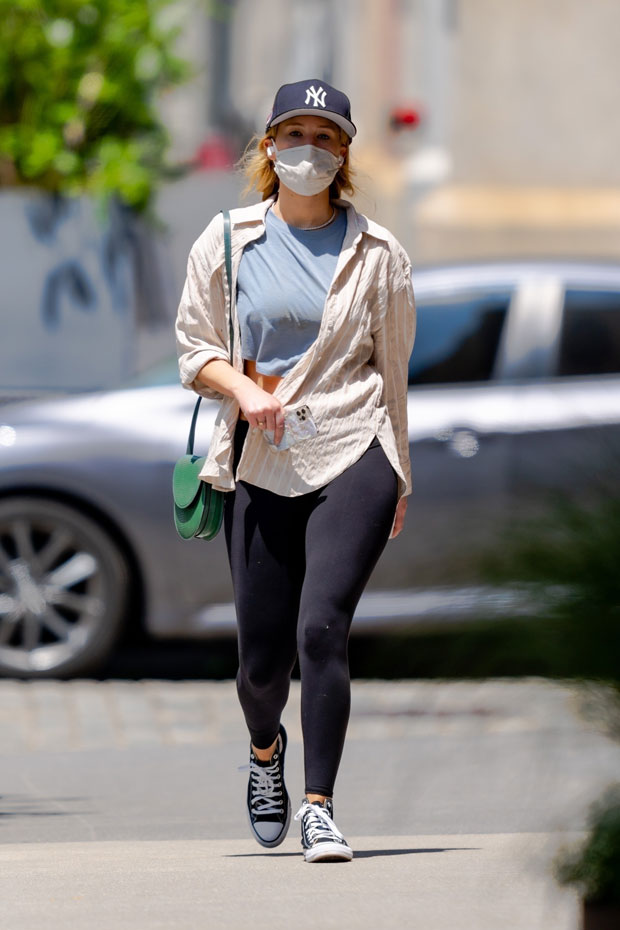 Jennifer Lawrence sports a white top and black leggings as she arrives back  to her apartment in New York City-010623_6