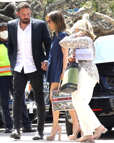 Malibu, CA  - *EXCLUSIVE*  - Ben Affleck brings a spiffy black suit and white shirt for a lunch date with his fiancee Jennifer Lopez and her mother, Guadalupe, at Soho House in Malibu.  Pictured: Jennifer Lopez, Guadalupe Rodríguez, Ben Affleck   BACKGRID USA 15 MAY 2022   BYLINE MUST READ: Vasquez-Max Lopes / BACKGRID  USA: +1 310 798 9111 / usasales@backgrid.com  UK: +44 208 344 2007 / uksales@backgrid.com  *UK Clients - Pictures Containing Children Please Pixelate Face Prior To Publication*