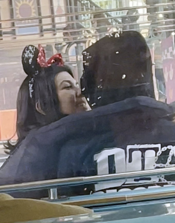 Kourtney Kardashian & Travis Barker Smooch At Disneyland