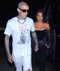 Kourtney Kardashian holds hands with Travis Barker at their NYC fashion week debut as a couple as they head to Carbone for dinner on 9/11 20th Anniversary. 12 Sep 2021 Pictured: Kourtney Kardashian, Travis Barker. Photo credit: Brian Prahl/MEGA TheMegaAgency.com +1 888 505 6342 (Mega Agency TagID: MEGA786330_016.jpg) [Photo via Mega Agency]