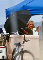 Malibu, CA  - *EXCLUSIVE*  - Lily James hides from the cameras dressed as Pamela Anderson on the set of 'Baywatch' while filming a scene for 'Pam and Tommy' in Malibu.

Pictured: Lily James

BACKGRID USA 12 MAY 2021 

BYLINE MUST READ: Rebels4Causes / BACKGRID

USA: +1 310 798 9111 / usasales@backgrid.com

UK: +44 208 344 2007 / uksales@backgrid.com

*UK Clients - Pictures Containing Children
Please Pixelate Face Prior To Publication*
