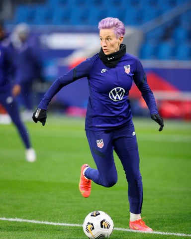 United States' Megan Rapinoe warms up before an international friendly women's soccer match between the United States and France in Le Havre, France US Soccer, Le Havre, France - 13 Apr 2021