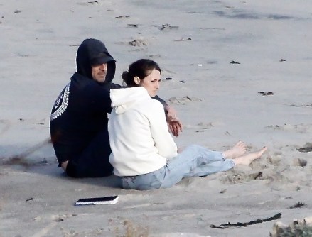 * EXCLUSIVE * Malibu, California - Actress Shailene Woodley and her football star fiancé Aaron Rodgers cuddle with their dog while enjoying the lovely Malibu sunset.  The couple recently announced that they are engaged and Shailene was seen wearing the star launcher.  Shailene had a notebook that she read from, and they both took turns throwing the German Shepherd a tennis ball to pick up.  Photo: Shailnee Woodley, Aaron Rodgers BACKGRID USA APRIL 8, 2021 BYLINE MUST READ: BACKGRID USA: +1 310 798 9111 / usasales@backgrid.com UK: +44 208 344 2007 / uksales * Picturesales @ backgrid.  Please pixel face before publication *
