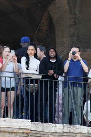 EXCLUSIVE: Kendrick Lamar and girlfriend Whitney Alford visit the Colosseum in Rome on vacation.  The famous rapper arrived with his girlfriend and family friends early in the morning, but the Colosseum was already full of tourists.  Lamar turned around with the hood of the sweatshirt over his head to avoid being recognized, but with such a tall bodyguard, it didn't go unnoticed.  After visiting the Roman forums.  They then had lunch at a restaurant in Trastevere.  After lunch they admired the view of Rome from Janiculum Hill.  April 22, 2018 Pictured: Kendrick Lamar.  Photo credit: MEGA TheMegaAgency.com +1 888 505 6342 (Mega Agency TagID: MEGA206743_001.jpg) [Photo via Mega Agency]