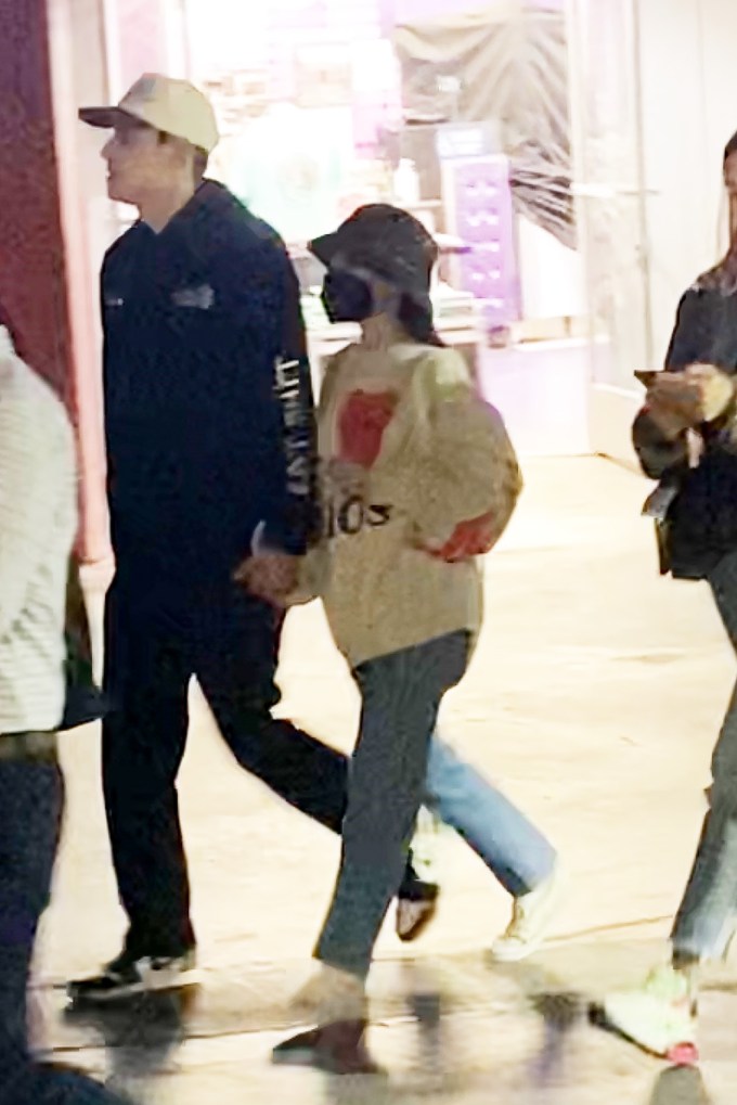 Ariana Grande & Dalton Gomez hold hands during an outing
