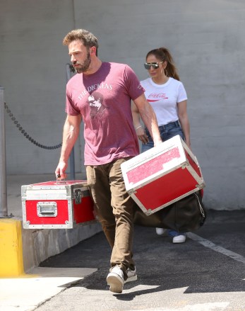 Jennifer Lopez flashes a smile as she and fiance Ben Affleck pick up camera equipment in Los Angeles.
The newly engaged couple visited The DJI Store in Burbank, a supplier of rented camera drones and stabilizers.
They emerged with Ben carrying various heavy cases of gear after the afternoon visit on Tuesday.
JLo looked radiant in retro Coca-Cola T-shirt with baggy jeans and her signature hoop earrings and high ponytail, as she flashed her huge engagement ring.
Affleck wore a T-shirt with The Dickens motif, a nod to his last movie The Tender Bar.

Pictured: Jennifer Lopez,Ben Affleck
Ref: SPL5306000 260422 NON-EXCLUSIVE
Picture by: MESSIGOAL / SplashNews.com

Splash News and Pictures
USA: +1 310-525-5808
London: +44 (0)20 8126 1009
Berlin: +49 175 3764 166
photodesk@splashnews.com

World Rights