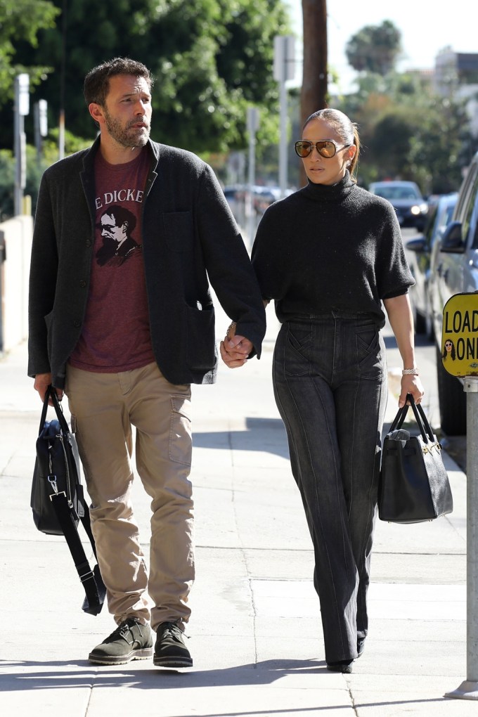 Ben Affleck & Jennifer Lopez hold hands while arriving at a music studio