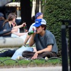 EXCLUSIVE: Jack Depp seen in Paris enjoying the sun in the Place des Vosges garden reading while drinking a beer