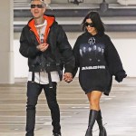 Beverly Hills, CA - *EXCLUSIVE* - Kourtney Kardashian and fiance Travis Barker match their styles in LA, with Kourtney repping her favorite German hard metal band 'Rammstein', as the couple film scenes for an upcoming episode of KUWTK in Beverly Hills.Pictured: Kourtney Kardashian, Travis BarkerBACKGRID USA 1 DECEMBER 2021 USA: +1 310 798 9111 / usasales@backgrid.comUK: +44 208 344 2007 / uksales@backgrid.com*UK Clients - Pictures Containing ChildrenPlease Pixelate Face Prior To Publication*