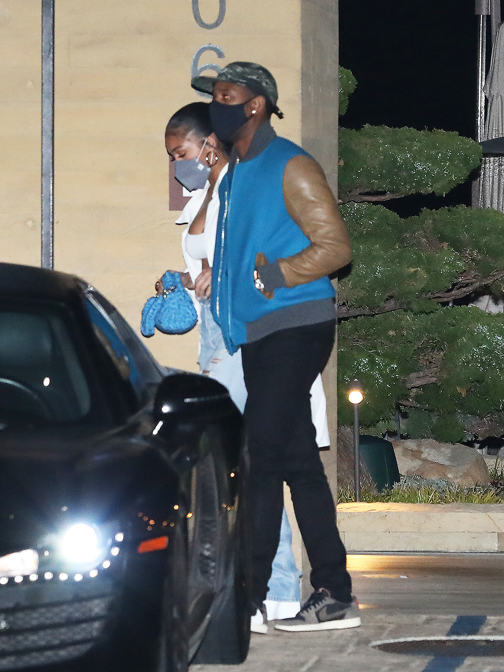 Michael B. Jordan and Lori Harvey walk arm in arm as they leave Nobu Malibu after having dinner