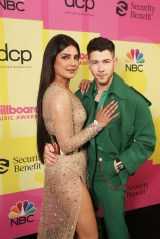 2021 BILLBOARD MUSIC AWARDS -- Pictured: (l-r) Priyanka Chopra and Nick Jonas of Jonas Brothers arrive to the 2021 Billboard Music Awards held at the Microsoft Theater on May 23, 2021 in Los Angeles, California. --  (Photo by: Todd Williamson/NBC)