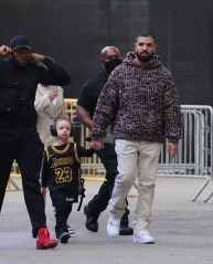 Los Angeles, CA  - *EXCLUSIVE* Drake arrives holding his son Adonis's hand for Los Angeles Lakers vs. Phoenix Suns game at Staples Center in Los Angeles.

Pictured: Drake

BACKGRID USA 3 JUNE 2021 

BYLINE MUST READ: ShotbyJuliann / BACKGRID

USA: +1 310 798 9111 / usasales@backgrid.com

UK: +44 208 344 2007 / uksales@backgrid.com

*UK Clients - Pictures Containing Children
Please Pixelate Face Prior To Publication*