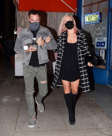 Los Angeles, California - *EXCLUSIVE* - Brian Austin Green and Sharna Burgess were spotted out on a date night on Tuesday, but it wasn't in the most likely place.  The pair were seen arriving at the Grand Opening of "Sugar Taco" in Sherman Oaks, which is co-owned by his ex, Australian model Tina Louise.  The friendly exes were seen greeting each other outside before Tina gave them both a tour of the colorful Vegan Mexican restaurant.  Brian and Sharna dined together for 30 minutes, grabbing drinks and vegan tacos while happily chatting with friends.  As they left, they both stopped to give Tina a big hug.  Everyone seemed in high spirits throughout the evening, including Brian who was still dealing with his ongoing divorce from Megan Fox.  She is said to be hoping to quickly move on from the past, but rumors are that Brian has made the process harder than it needs to be, slowing her down from moving forward with her steamy new relationship with Machine Gun Kelly Picture: Brian Austin Green and Sharna Burgess BACKGRID USA 3 FEBRUARY 2021 USA: +1 310 798 9111 / usasales@backgrid.com UK: +44 208 344 2007 / uksales@backgrid.com *UK Customers - Please pixelate images containing children face*